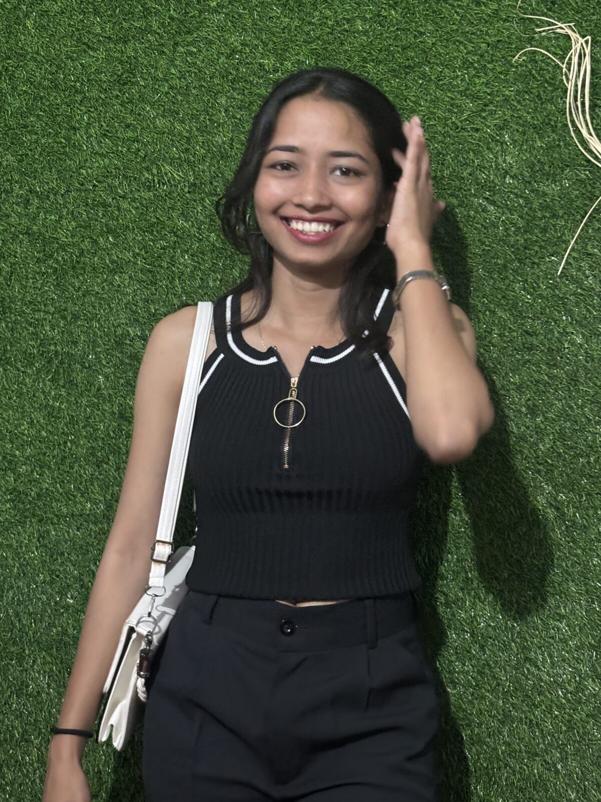 Black zip-up crop top with white piping and front zipper